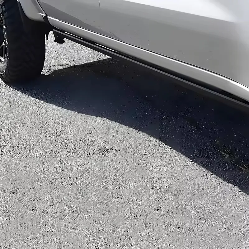 Low-angle view showing retracted Chevy Silverado Power Running Boards tucked neatly under a vehicle.