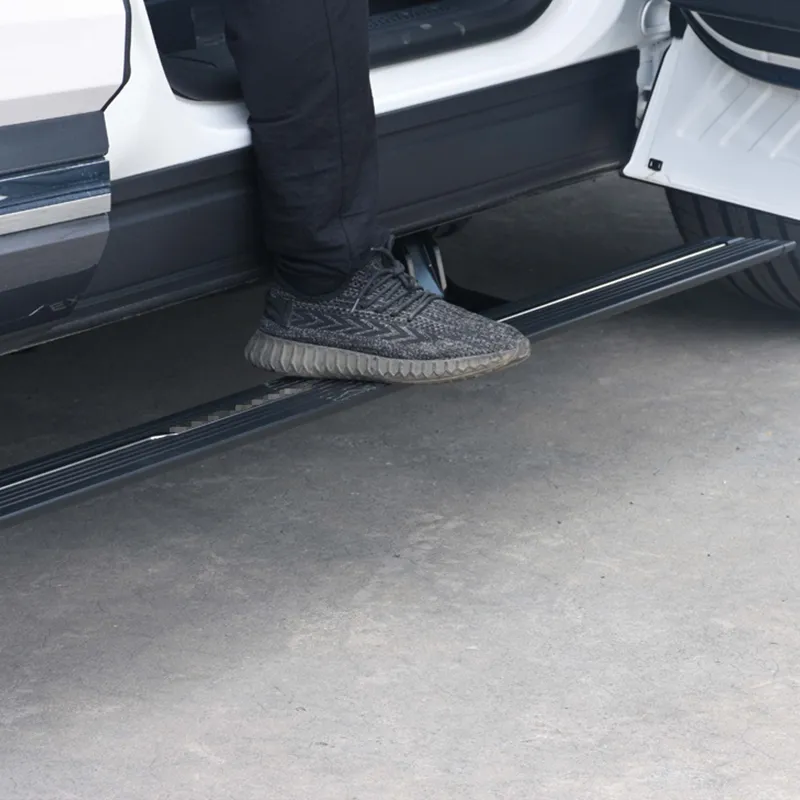Close-up of a shoe stepping securely onto the textured surface of gmc sierra running boards.
