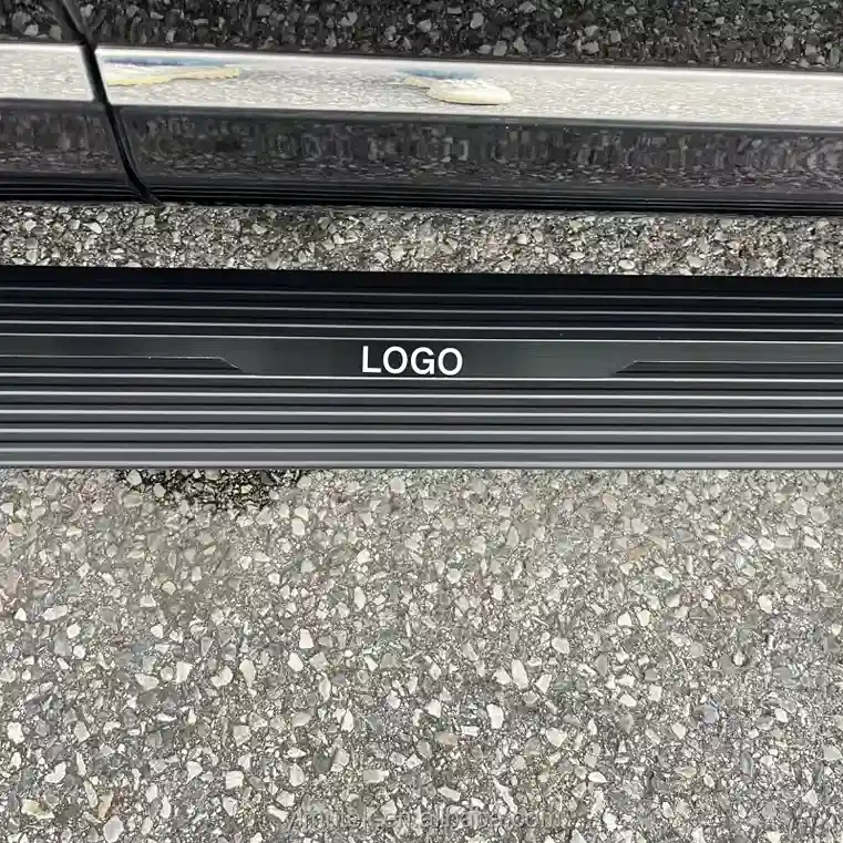 Close-up of the ribbed aluminum electric running boards ram 1500 with a custom LOGO plate.