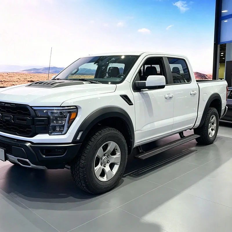 A white Ford F-150 in a showroom with the electric running boards fully deployed, highlighting its rugged design and ford f150 towing capacity.