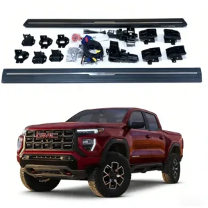 Overhead view of electronic step boards, motors, and wiring harnesses paired with a red gmc canyon truck.