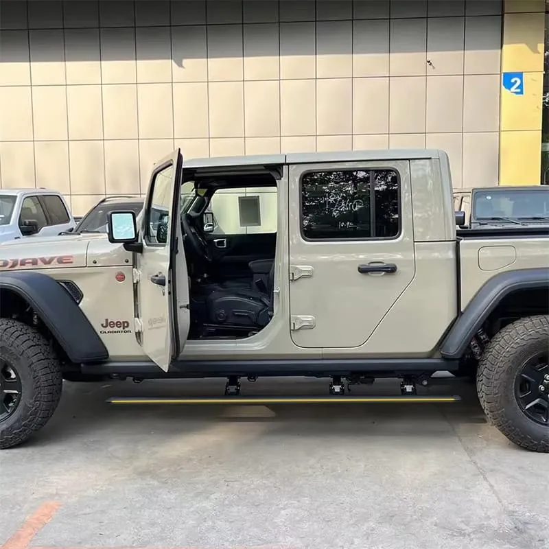 Side view of a tan Jeep Gladiator Mojave truck with open door and extended jeep gladiator running boards.