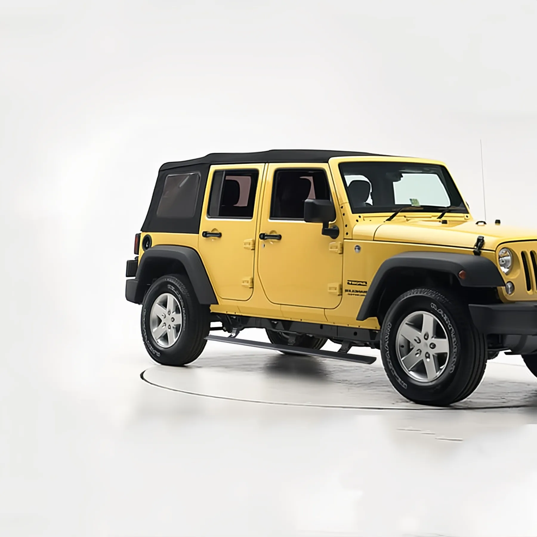 Rear three-quarter view of yellow Jeep Wrangler JK equipped with automatic jeep jk running boards