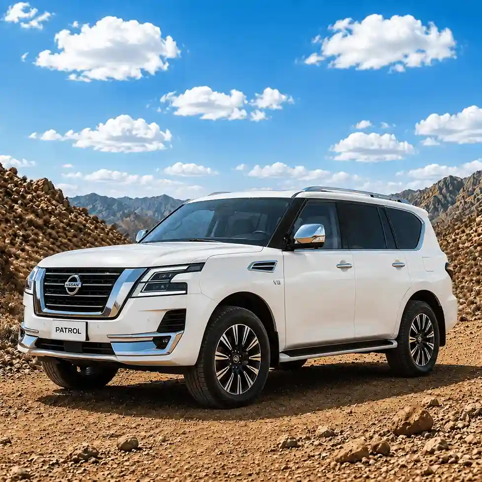 White Nissan Patrol SUV equipped with heavy-duty nissan running boards parked on a rocky desert terrain.