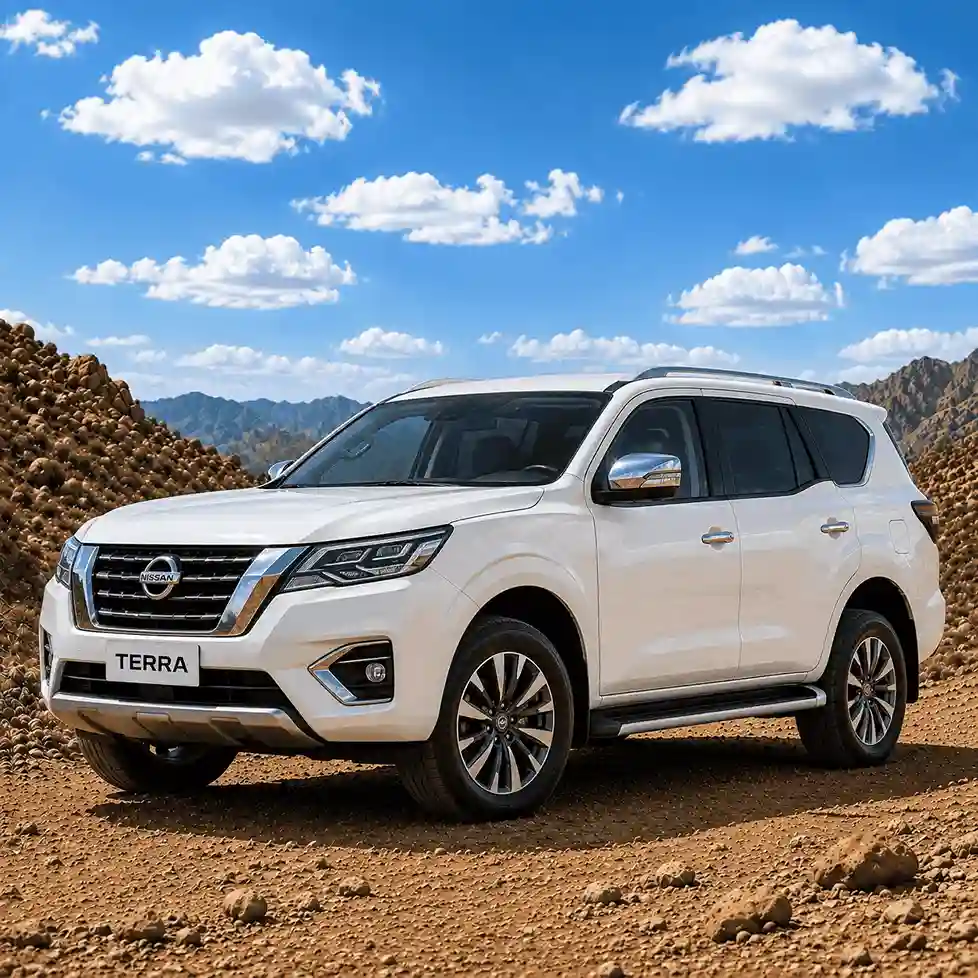 Front angle of a white Nissan Terra SUV equipped with practical nissan running boards on a rough gravel road.