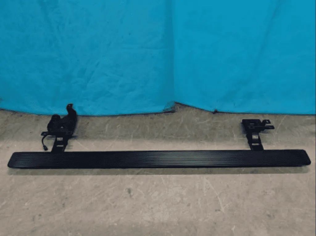 Electric power running boards sample with mounting brackets ready for functional testing