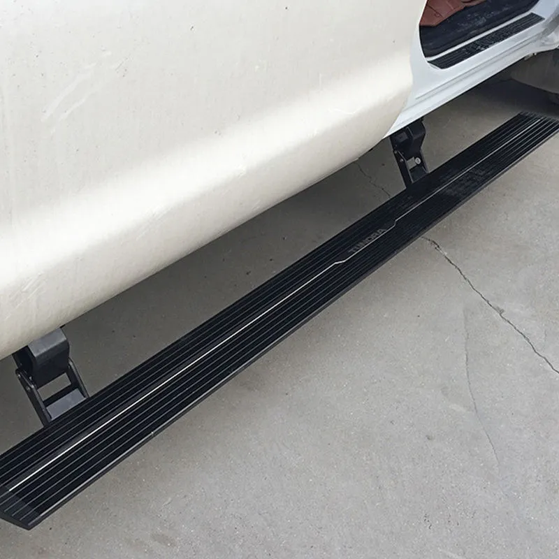Side profile view of a white vehicle equipped with motorized ford f150 running boards.