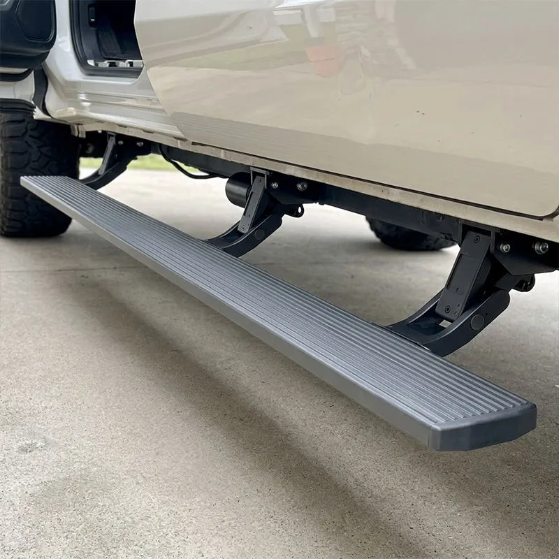 Close-up shot of the deployed running board for Tundra TRD Pro with the door open, showing the grooved anti-slip surface for secure entry.