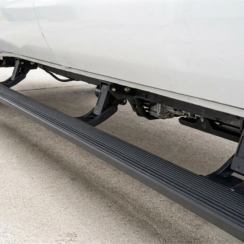 Detailed view of the lower chassis and heavy-duty pivot brackets with motor assembly for the automatic running board for Tundra TRD Pro.