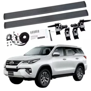 Complete Toyota Fortuner Power Running Boards kit featuring a pair of black running boards, motors, mounting brackets, wiring harness, and installation hardware.
