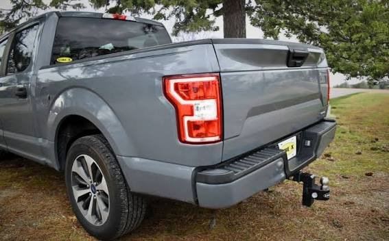 Durable drop hitch installed on a gray truck, a top-rated choice among the best truck accessories for safe and reliable towing.