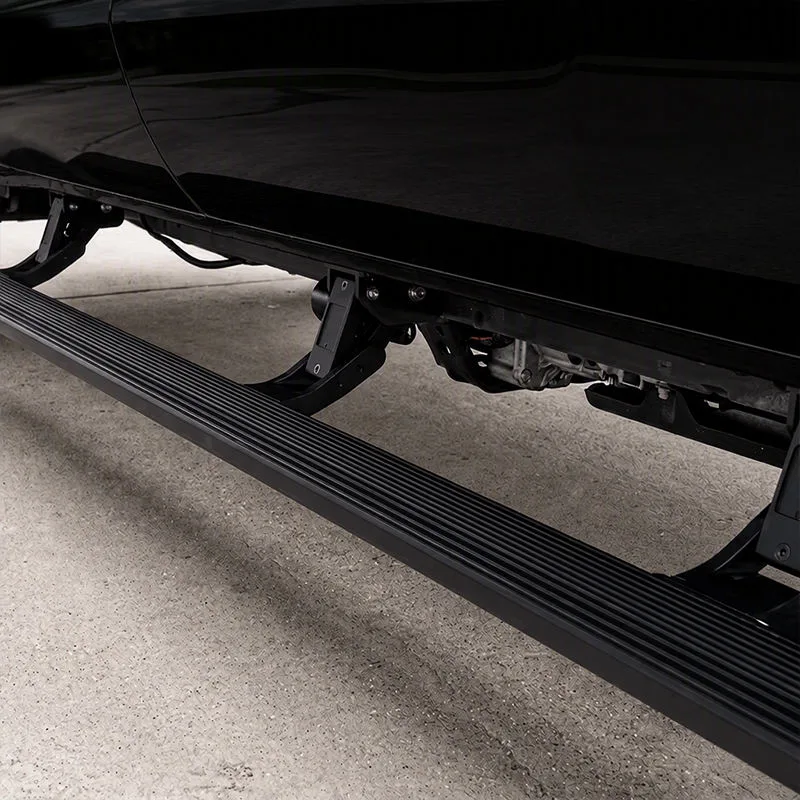 Detailed close-up of the deployed BYD Shark 6 Electric Side Steps, highlighting the anti-slip textured running board, sturdy folding brackets, and undercarriage clearance on a wet surface.