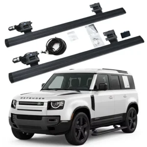 Defender 130 Electric Side Steps complete kit with running boards, motors, mounting brackets, wiring harness, and control module, shown with a white Defender 130.