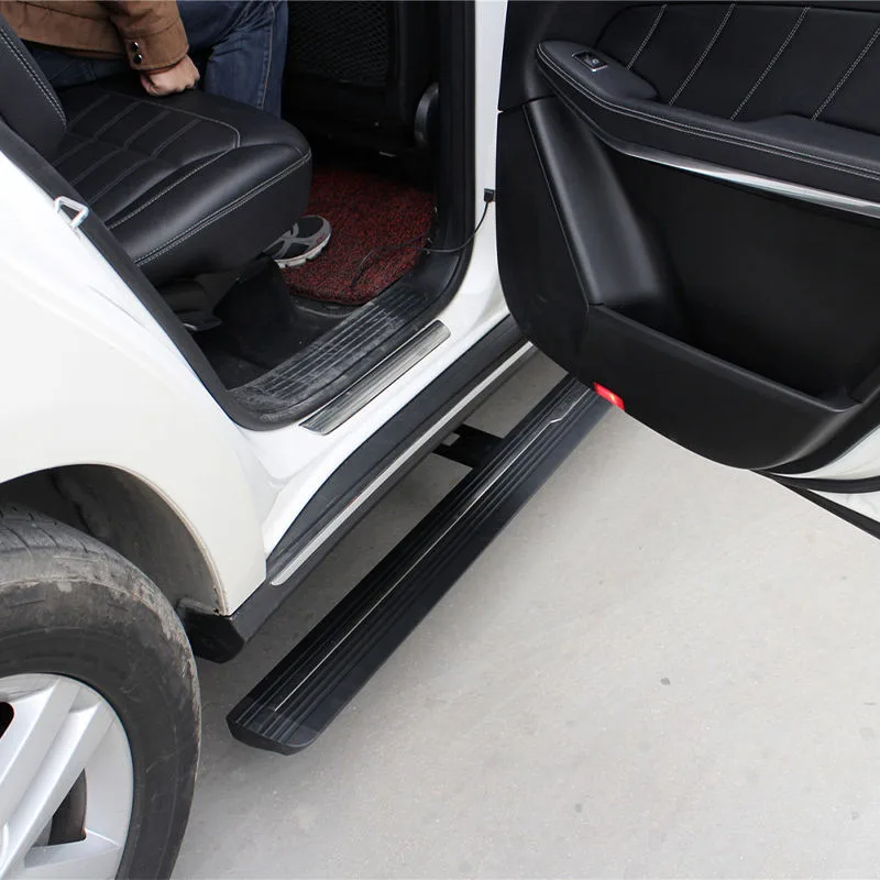 A person entering a white SUV using the extended Mercedes-Benz GL Electric Running Boards, highlighting the practical step-up access and robust design.