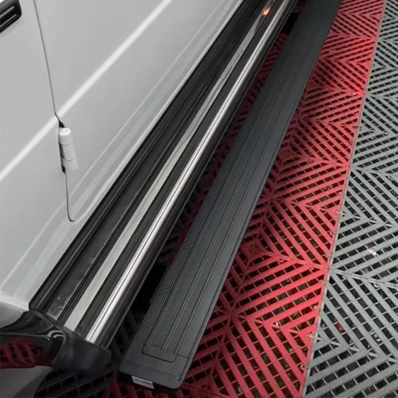 Detailed view of the extended Mercedes-Benz G550 Electric Running Boards on a white G-Class, highlighting the sleek step design and deployment structure.