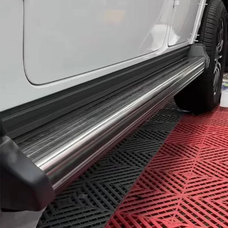 Side view of a white Mercedes-Benz G550, showing the sleek retracted profile of the Mercedes-Benz G550 Electric Running Boards tucked closely against the vehicle's undercarriage.