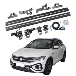 A complete T-Roc electric side steps kit featuring black running boards, motorized hinges, aluminum brackets, wiring harness, control module, and mounting hardware, displayed above a white Volkswagen T-Roc SUV.