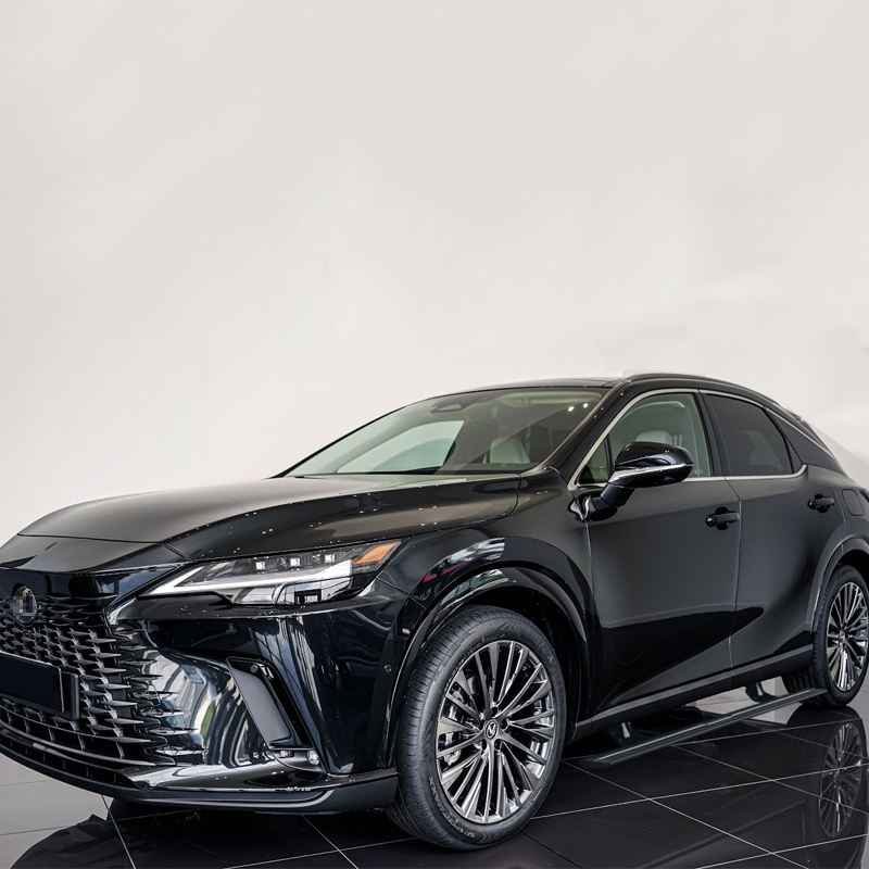 Black Lexus RX SUV parked in a studio with deployed lexus rx450h electric running boards.