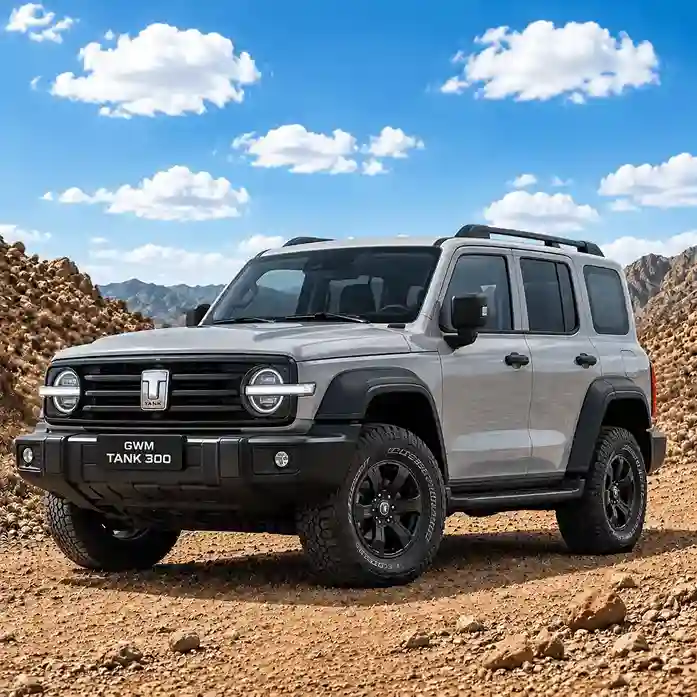 A grey GWM Tank 300 SUV parked on a rocky desert trail under a blue sky, featuring GWM electric side steps.