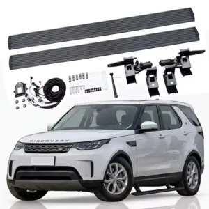 Complete kit for Land Rover Discovery 5 Electric Side Steps, featuring dual running boards, motors, mounting brackets, and wiring harness, displayed above a white Land Rover Discovery 5.