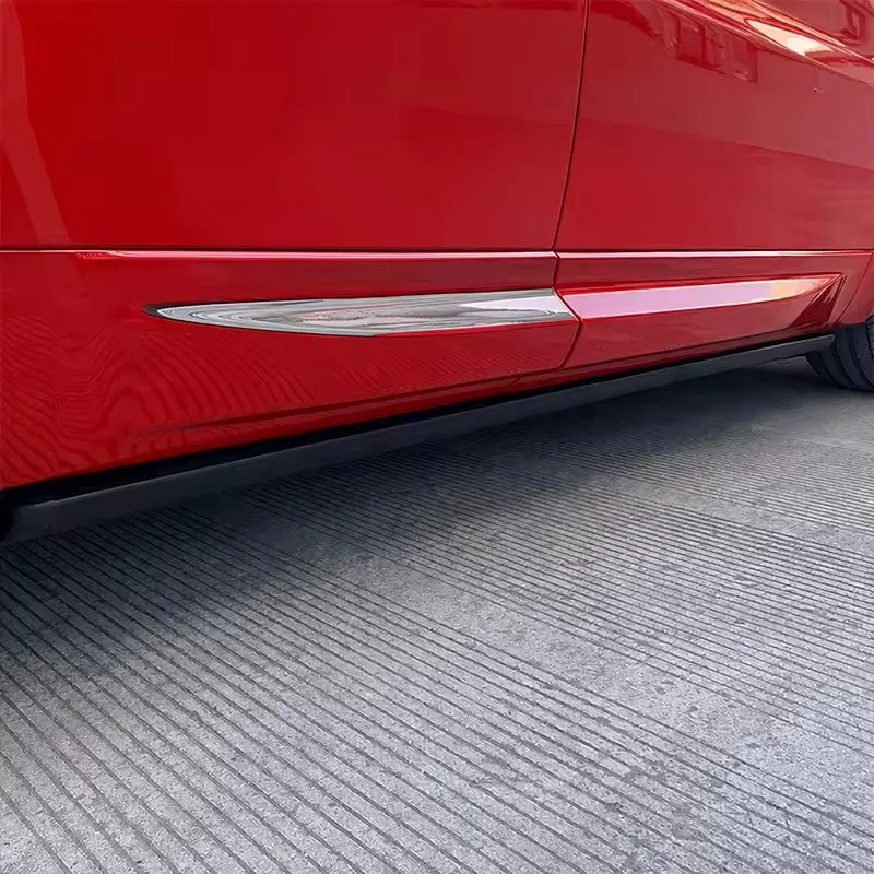 Close-up of the lower side skirt of a red Range Rover Sport, showing the housing and profile of the retracted Range Rover Sport Electric Side Steps.