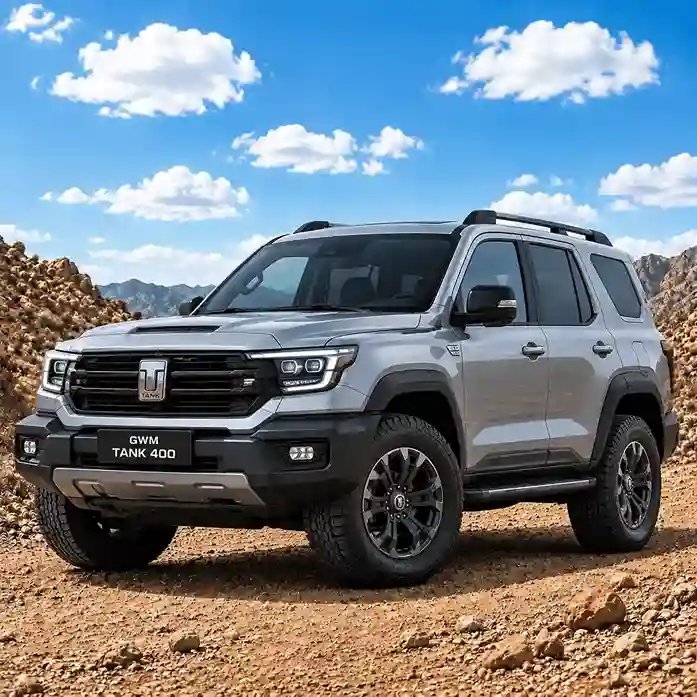 A silver GWM Tank 400 SUV parked on a rocky desert terrain under a blue sky, equipped with GWM electric side steps.