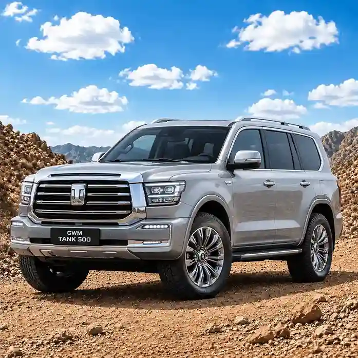 A silver GWM Tank 500 SUV parked on a rocky desert trail under a blue sky, featuring GWM electric side steps.