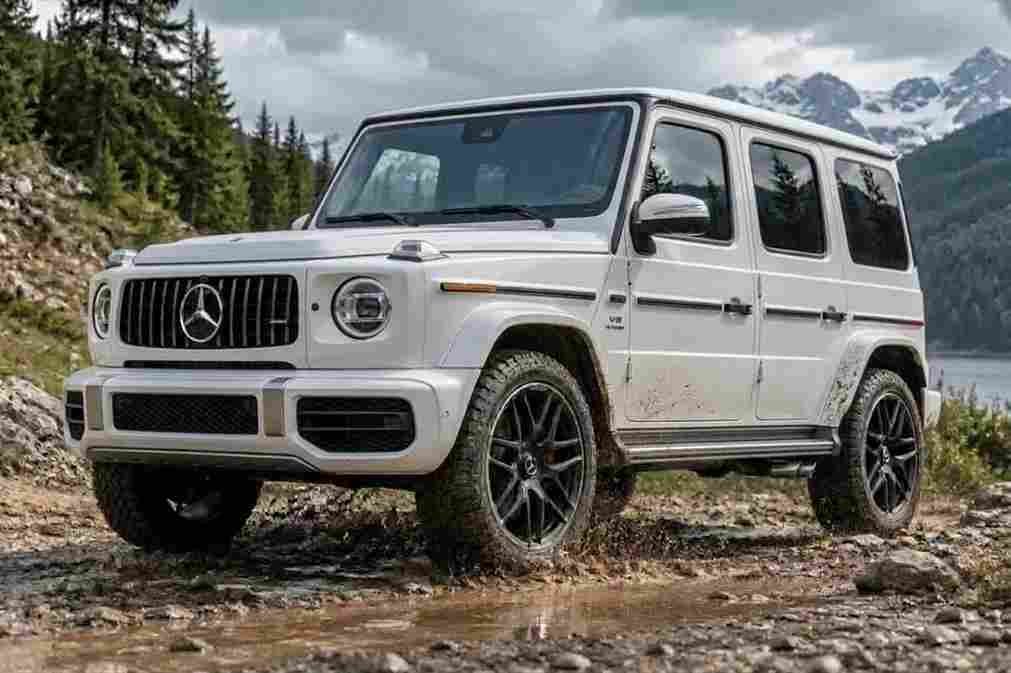 A white Mercedes-Benz G-Class driving through a rocky mountain stream, featuring mercedes-benz-electric-running-boards.