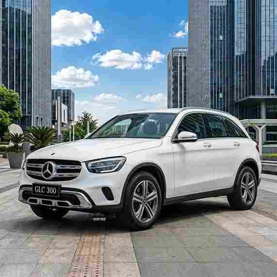 White Mercedes-Benz GLC 300 parked in a city square, featuring mercedes-benz-electric-running-boards.