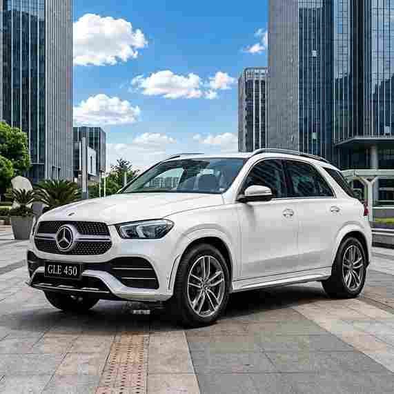White Mercedes-Benz GLE 450 SUV parked in an urban plaza with mercedes-benz-electric-running-boards.