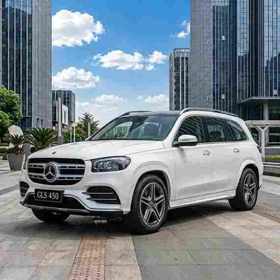 White Mercedes-Benz GLS 450 SUV parked outdoors, fitted with mercedes-benz-electric-running-boards.