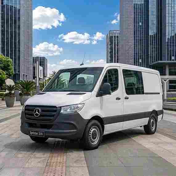 White Mercedes-Benz Sprinter 315 panel van in a city square, featuring mercedes-benz-electric-running-boards
